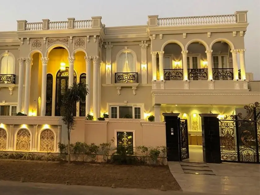 This image showcases a traditional Spanish house design, perfect for those seeking classic Mediterranean architecture. With iconic red-tiled roofs, white stucco walls, and beautiful arched doorways, this style brings a touch of Spanish elegance to any neighborhood. Ideal for those looking for a blend of aesthetics and comfort, Spanish house designs feature spacious courtyards, intricate wrought iron details, and terracotta flooring. Whether you want to build a new home or renovate your existing space, these designs provide inspiration for creating a timeless and charming atmosphere. Choose the best in Spanish home architecture with expert guidance from Sargodha Builders